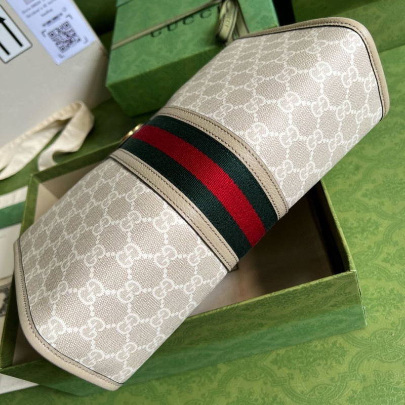 G*u*i clutch bags